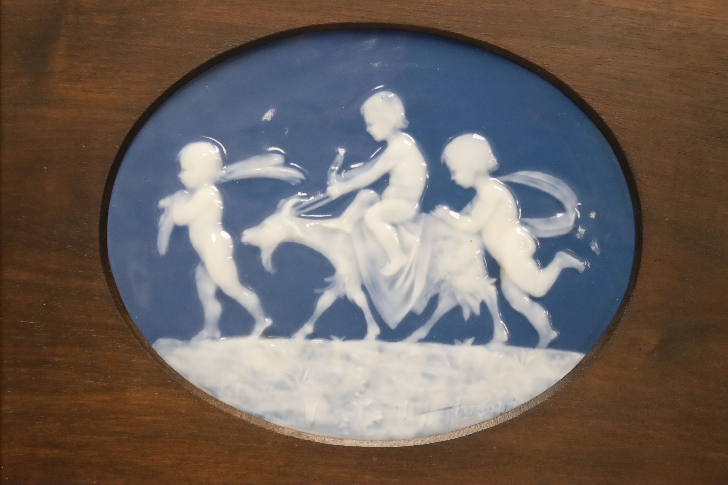 An early 20th century Limoges pate sur pate oval plaque, 18.5x 23.5cm, framed Frame external - 43x49cm